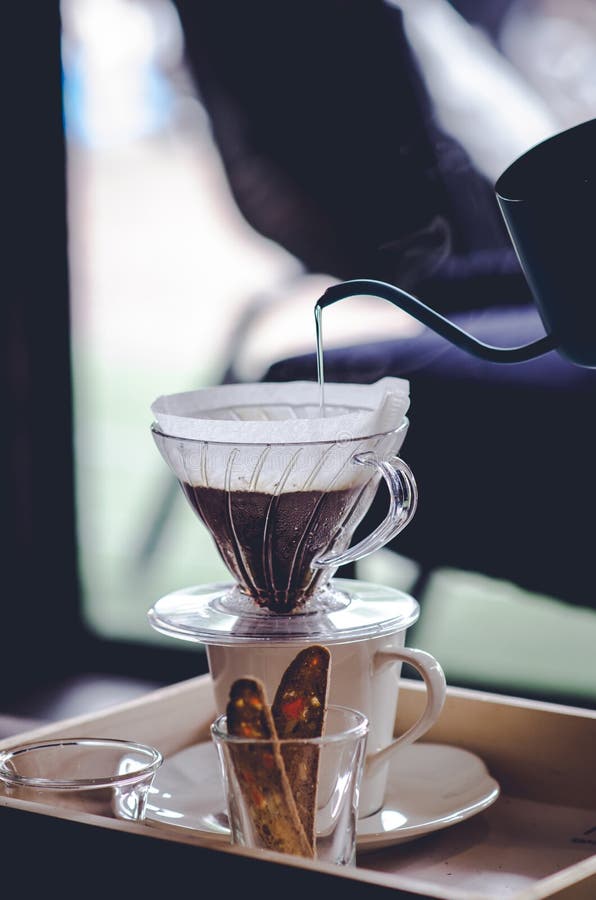 Making Brewed Coffee from Steaming Filter Drip Style Stock Image