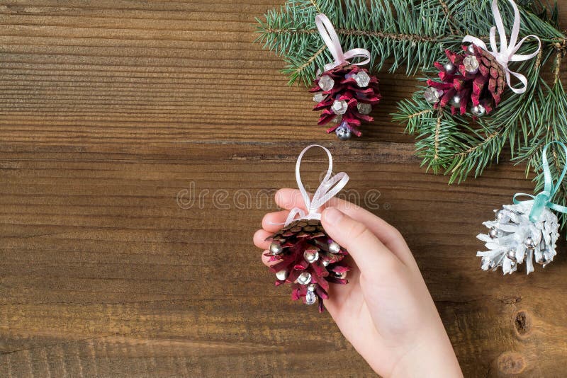 Making Christmas decorations from pine cones. Step 6