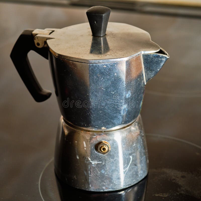 Hot Coffee in Moka Pot on Electric Stove ,vintage Coffee Maker on Wooden  Table at Home, Selective Focus Stock Image - Image of drink, brown:  239947361