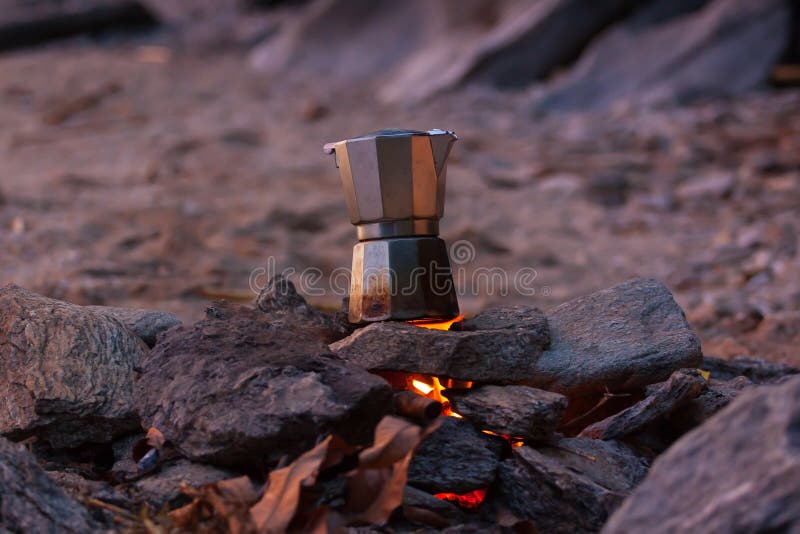 Making a cup of coffee on the beach. royalty free stock photo Making a cup of coffee on the beach. royalty free stock photo