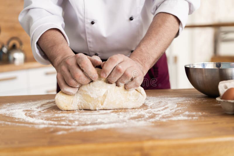 Baker Making Bread , Man Hands , Kneading a Dough , Cooking Coat. Stock