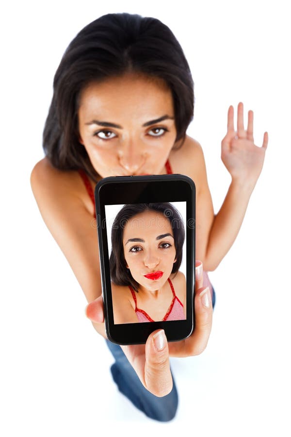 Brunette girl taking self picture with her smartphone - mobile sexting. Brunette girl taking self picture with her smartphone - mobile sexting.