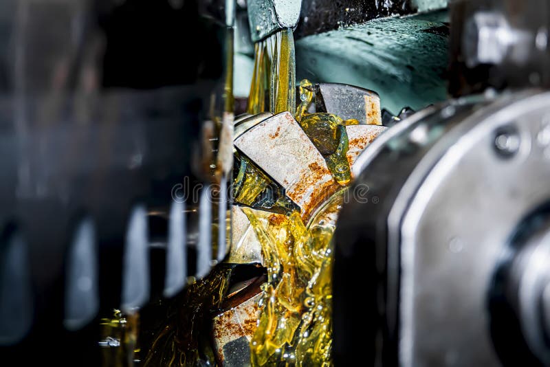 Making Gears on a Gear Cutting Machine. Machine Oil Cools the Cutting