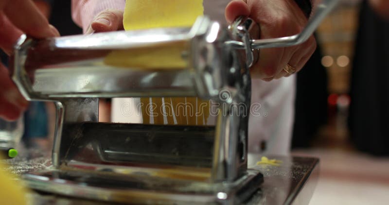 Making Homemade Pasta. Using a Pasta Machine, the Chef Prepares Pasta