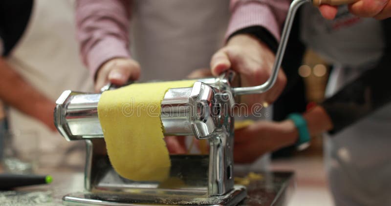 Making Homemade Pasta. Using a Pasta Machine, the Chef Prepares Pasta