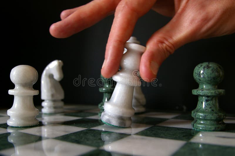 Hand Of A Man Taking A Chess Piece To Make The Next Move In A Chess Game.  Close Up. Spring Day Outside. Stock Photo, Picture and Royalty Free Image.  Image 198493516.