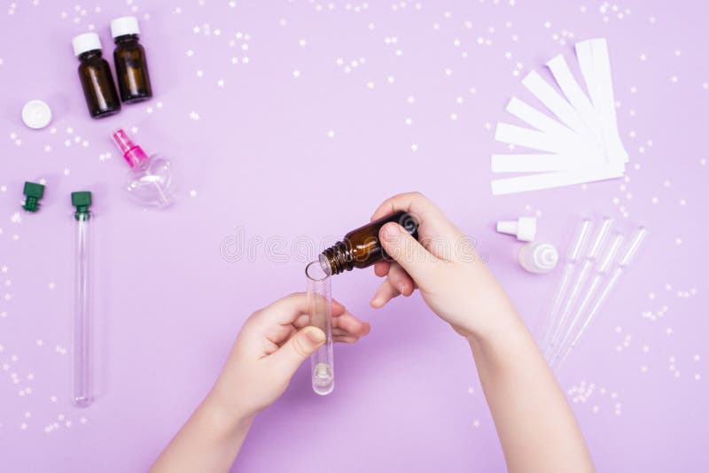 Making Perfumes at Home. Children`s Art Project. Children`s Hands Make Perfume.DIY Concept Stock