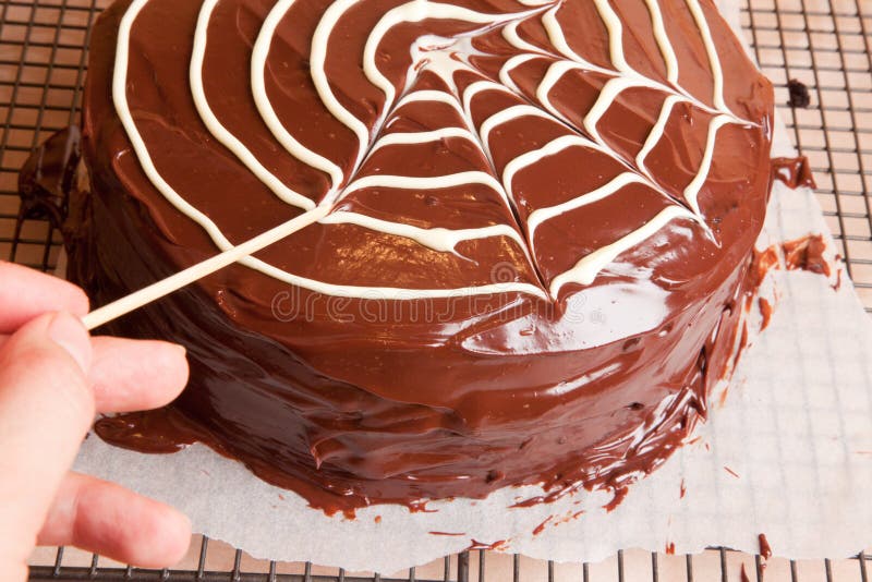 Making Spiders Web on the Chocolate Cake Stock Photo - Image of ...