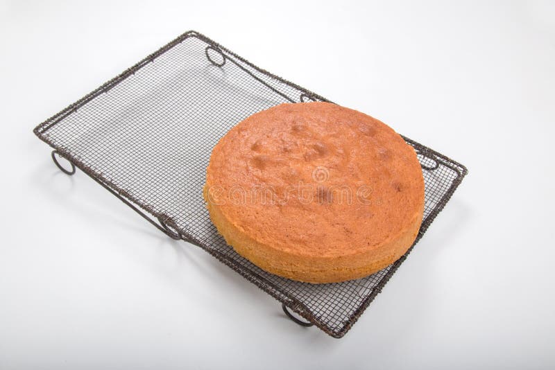 Making Sponge Cakes, Cooked Cake on an Old Cooling Rack Stock Photo