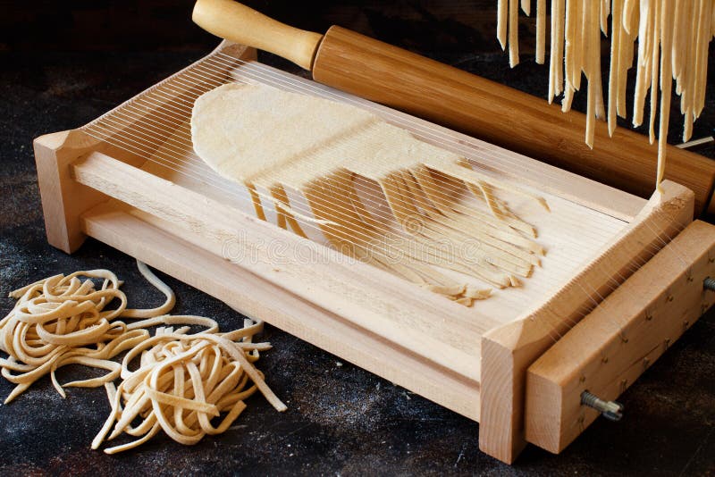 Making Tagliolini Pasta Alla Chitarra with a Tool Stock Image