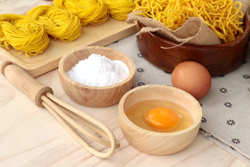 Making Yellow Noodle with Egg and Wheat Flour. Stock Photo Image of