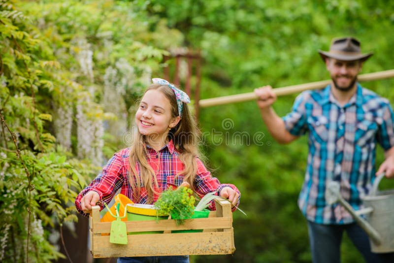 Making your life bright and colored. ecology. Gardening tools. father and daughter on ranch. spring village country stock photography Making your life bright and colored. ecology. Gardening tools. father and daughter on ranch. spring village country stock photography