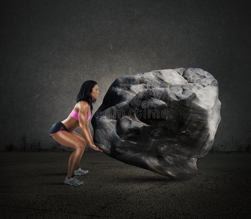 Muscular woman lifts a big boulder heavy. Muscular woman lifts a big boulder heavy