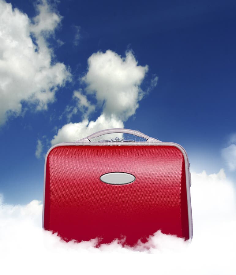 Red suitcase siting in the middle of a cloud in a surreal fashion with sky background. Red suitcase siting in the middle of a cloud in a surreal fashion with sky background