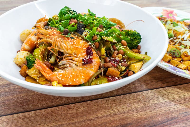 Mala Xiang Guo stir-fry pot. China Chongqing Sichuan Spicy Fragrant Pot. Oily, spicy, and numbing Chinese sauce which consists royalty free stock image