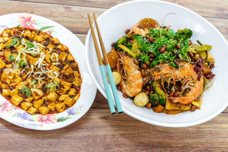 Mala Xiang Guo stir-fry pot, and Mapo Toufu bean curd, China Chinese Sichuan Chengdu Chongqing spicy food on table stock images