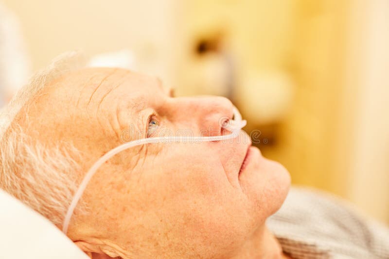 Sick senior man with oxygen nasal cannula in hospital or nursing home. Sick senior man with oxygen nasal cannula in hospital or nursing home