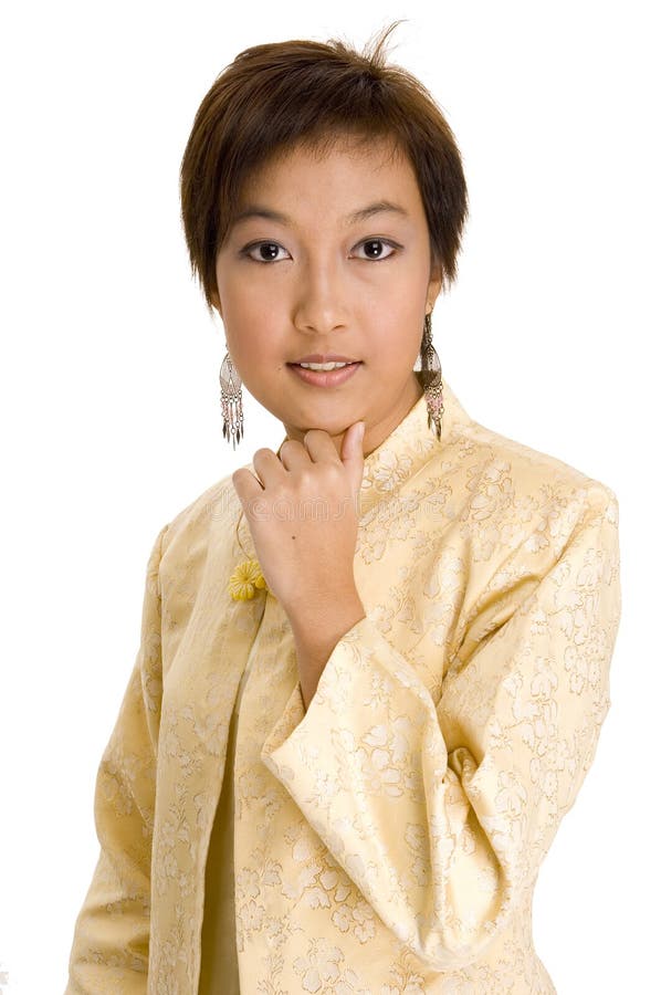 A pretty young asian woman with short hair in a yellow silk jacket. A pretty young asian woman with short hair in a yellow silk jacket