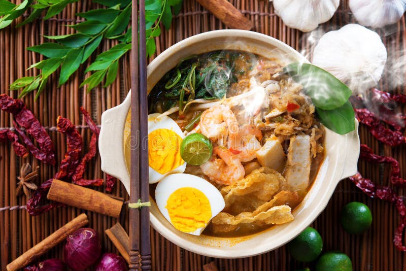 Malaysian food. Prawn mee, prawn noodles. Popular Malaysian food spicy fresh cooked har mee in clay pot with hot steam. Asian cuisine stock images