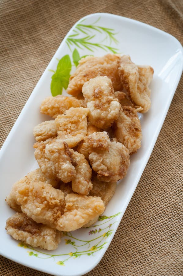 Malaysian Style Battered and Deep Fried Dory Fish Cubes. Stock Photo
