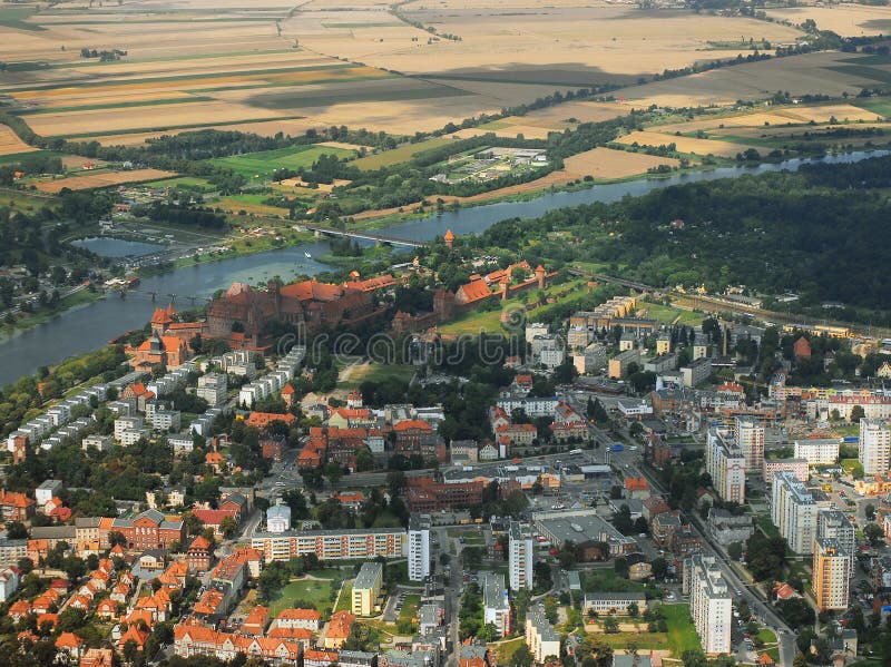 Malbork city baerial view. Downtown and castle area. Summer time, daylight. Malbork city baerial view. Downtown and castle area. Summer time, daylight.