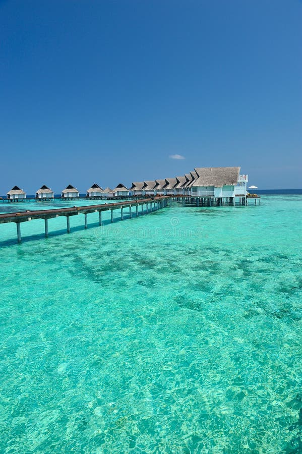Maldives bungalows on the blue sea stock photo