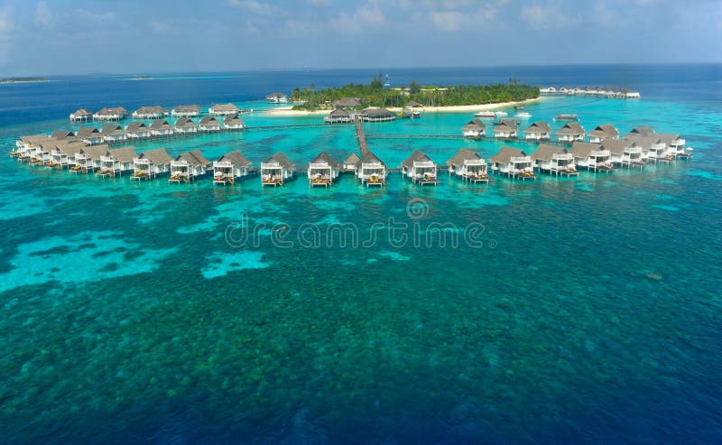 Maldives island and water villas stock photo