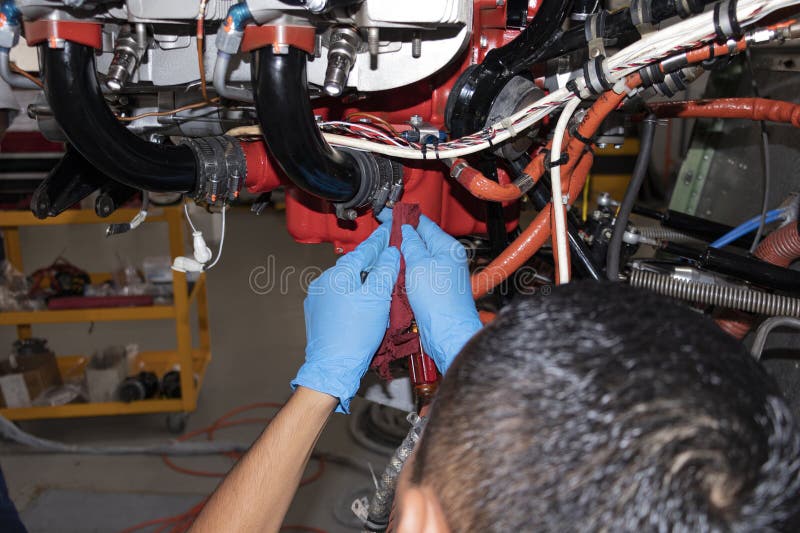 aircraft-maintenance-technician-making-a-torque-stripe-stock-photo