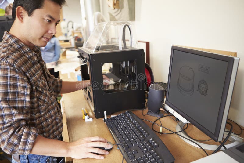 Male Architect Using 3D Printer In Office stock photo