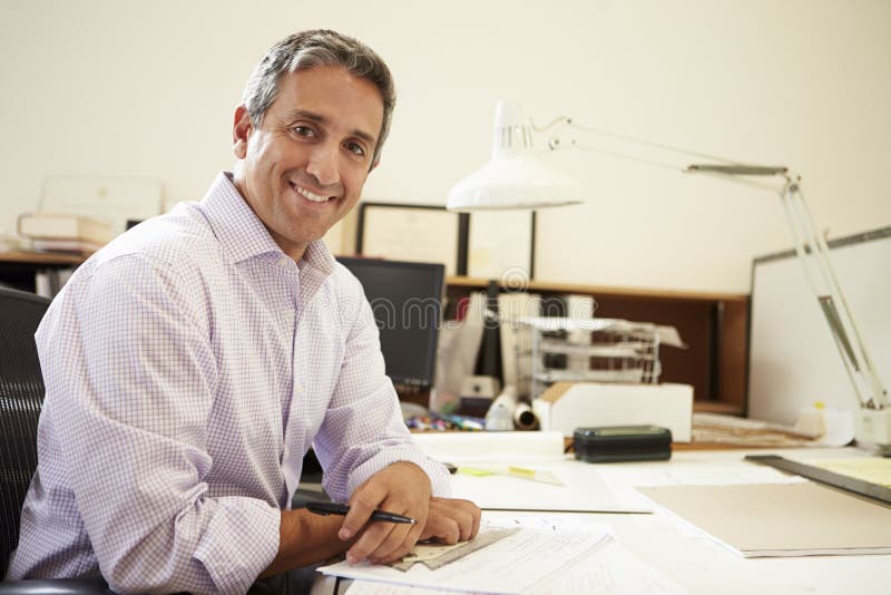 Male Architect Working At Desk In Office royalty free stock photo