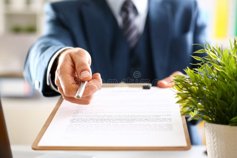 Male arm in suit offer contract form on clipboard