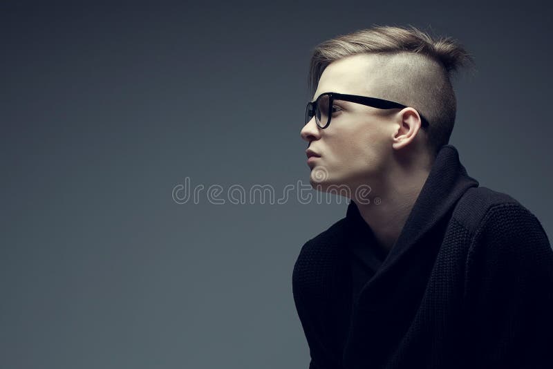 Male Beauty Concept. Portrait of a Fashionable Young Man with Stylish Haircut  Wearing Trendy Glasses and Sweater & Posing Over Stock Image - Image of  care, confident: 149524531