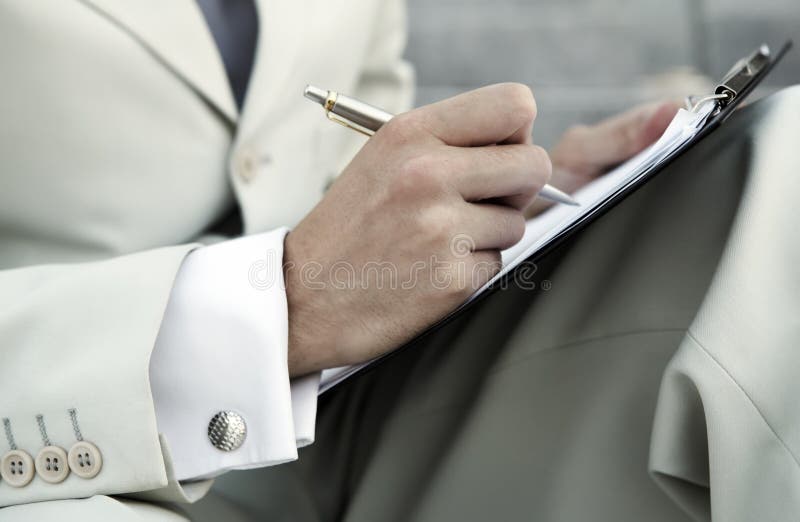 Male business executive sitting on stairs