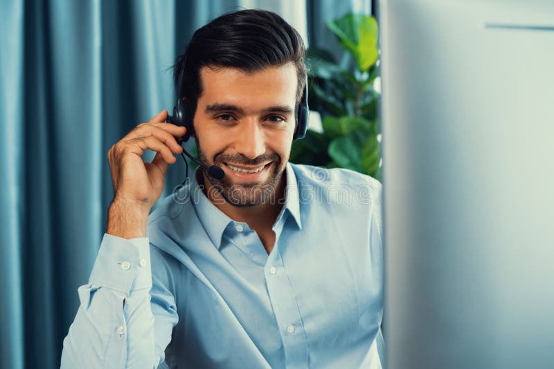 Male Call Center Operator or Telesales Agent Working on His Desk ...