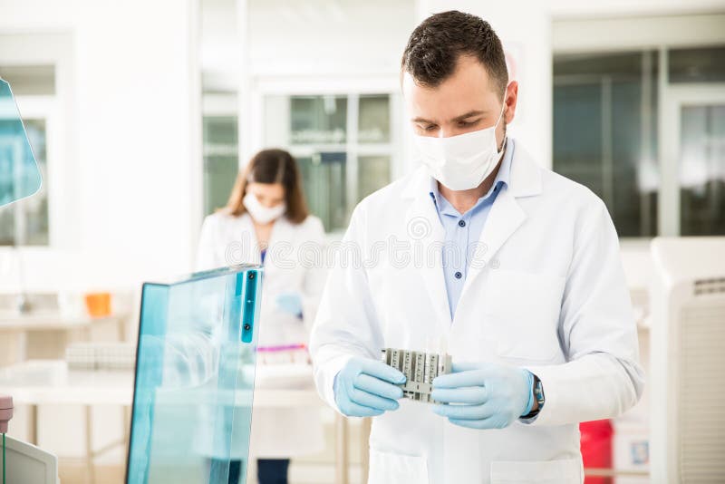 Male Chemist Setting Up a Blood Test Stock Image Image of female