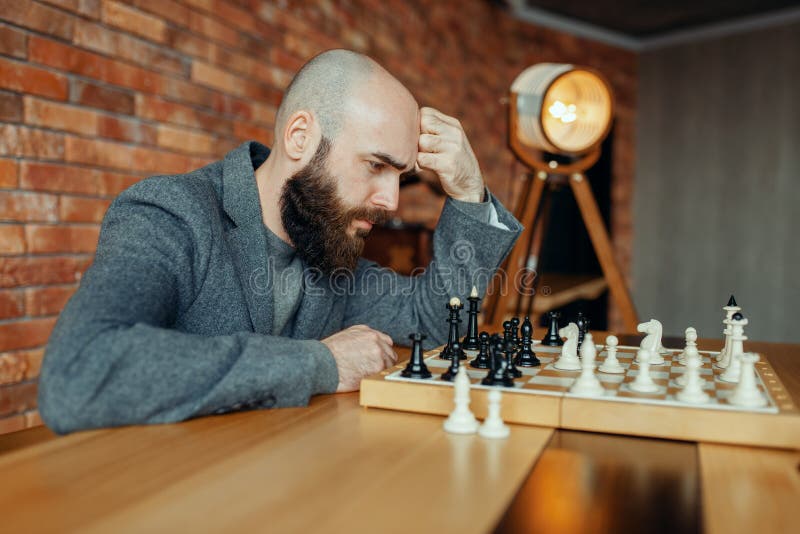 Male chess player with figures in the eyes, thinking process