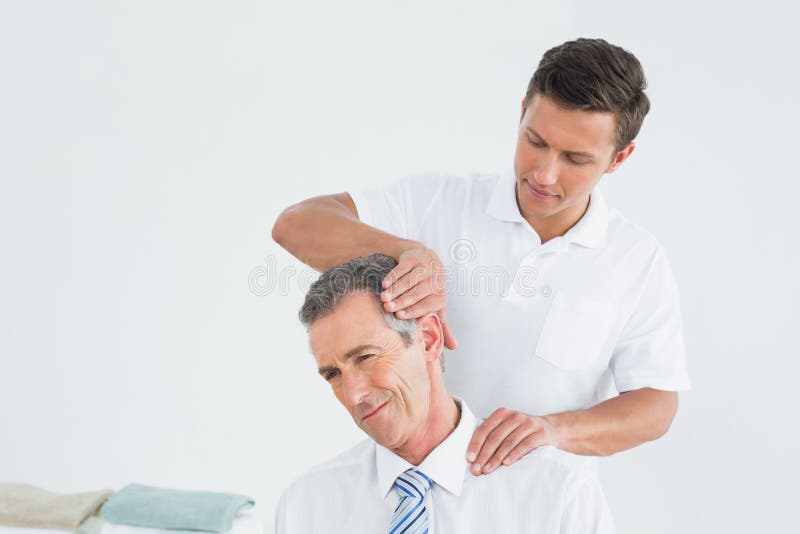 Male Chiropractor Doing Neck Adjustment Stock Image Image of cure