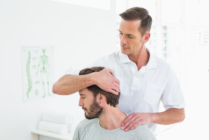 male-chiropractor-doing-neck-adjustment-