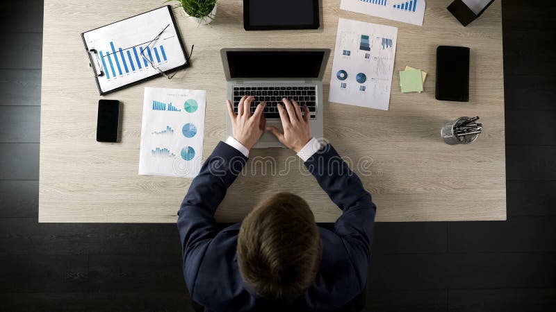 Male company director typing on laptop, planning project or business strategy stock photography Male company director typing on laptop, planning project or business strategy stock photography