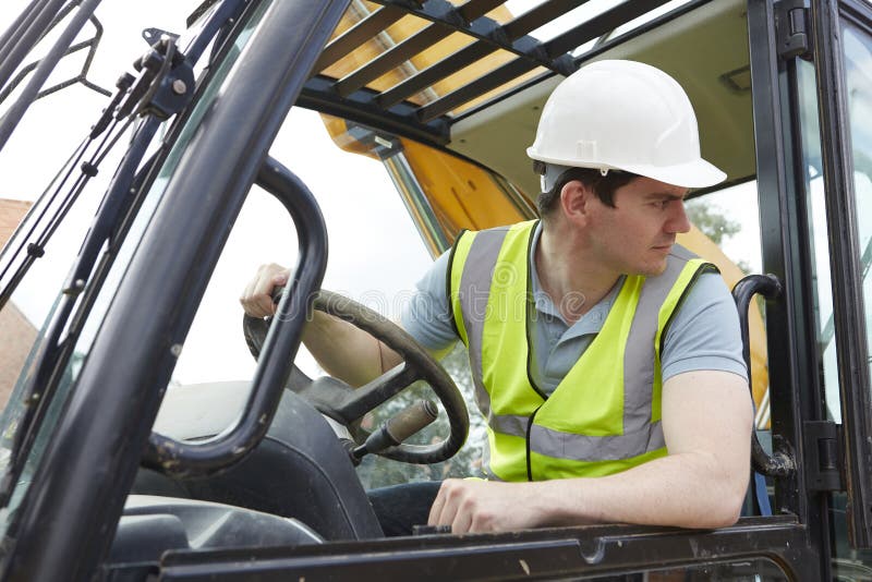 Male Construction Worker Driving Digger stock photo