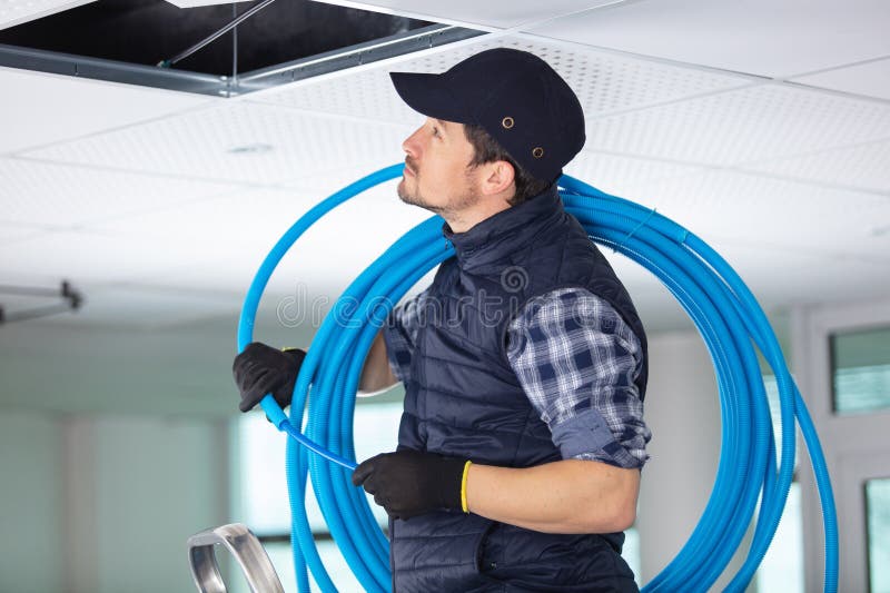Male Construction Worker Installing Cable Ducting Stock Photo Image