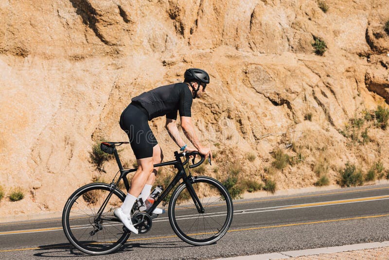 Male Cyclist on His Road Bike Doing Intense Training Stock Image