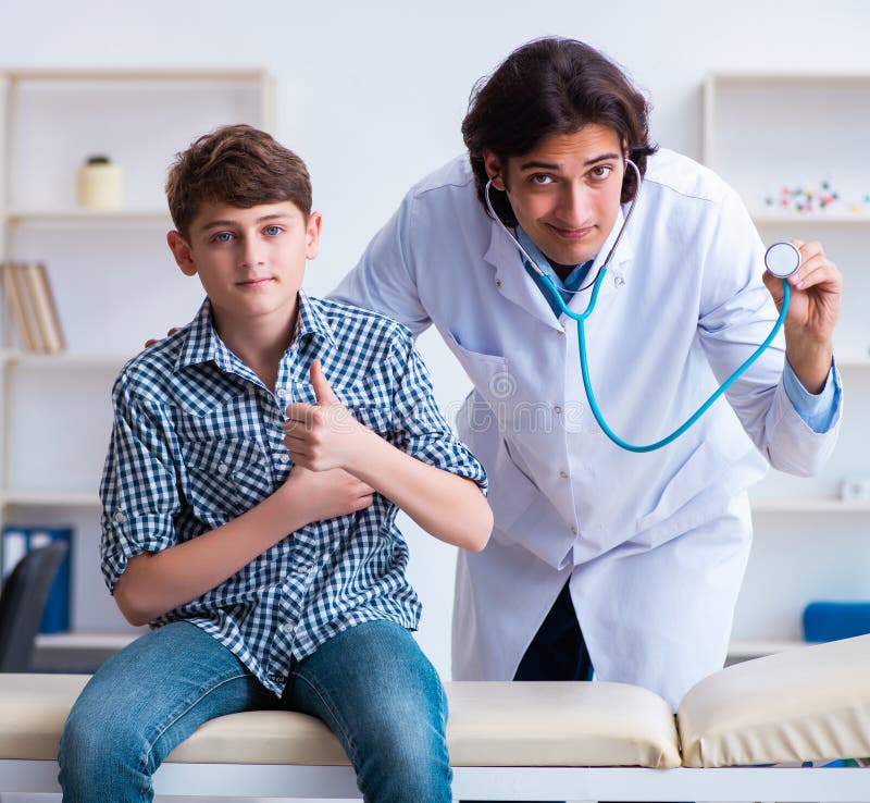 Male Doctor Examining Boy by Stethoscope Stock Image Image of