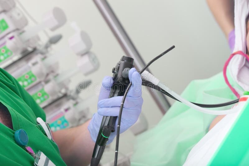 Male Doctor Performs a Scheduled Endoscopic Checkup To the Patient