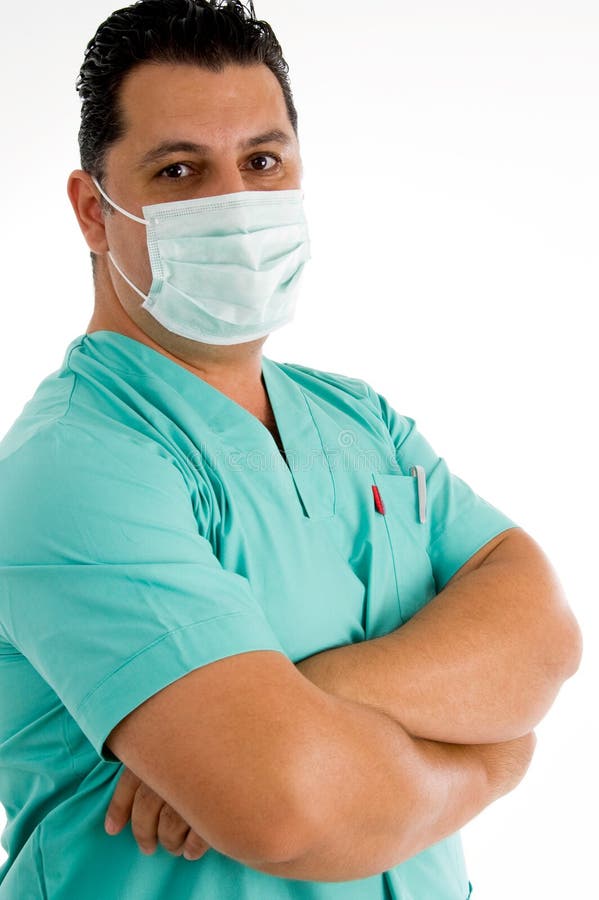 Male doctor posing with face mask