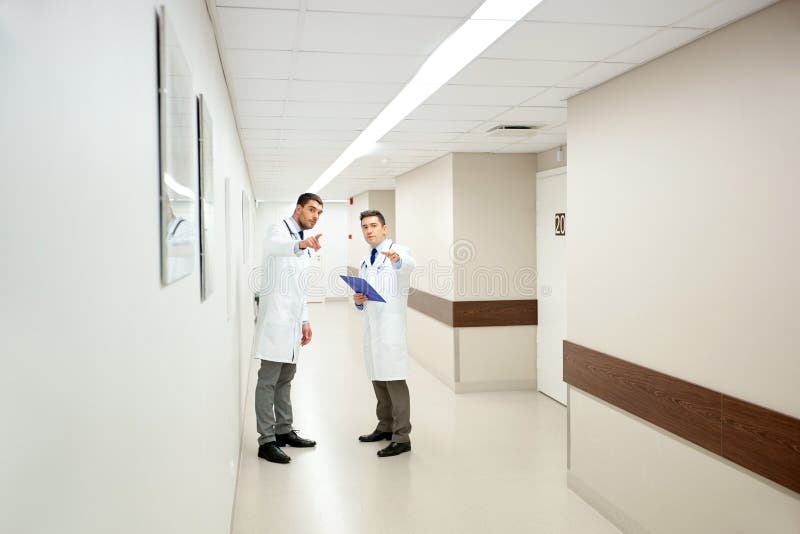 Male doctors with clipboard at hospital