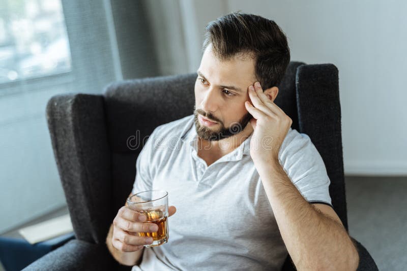 Sad upset man drinking alcohol stock images Sad upset man drinking alcohol stock images