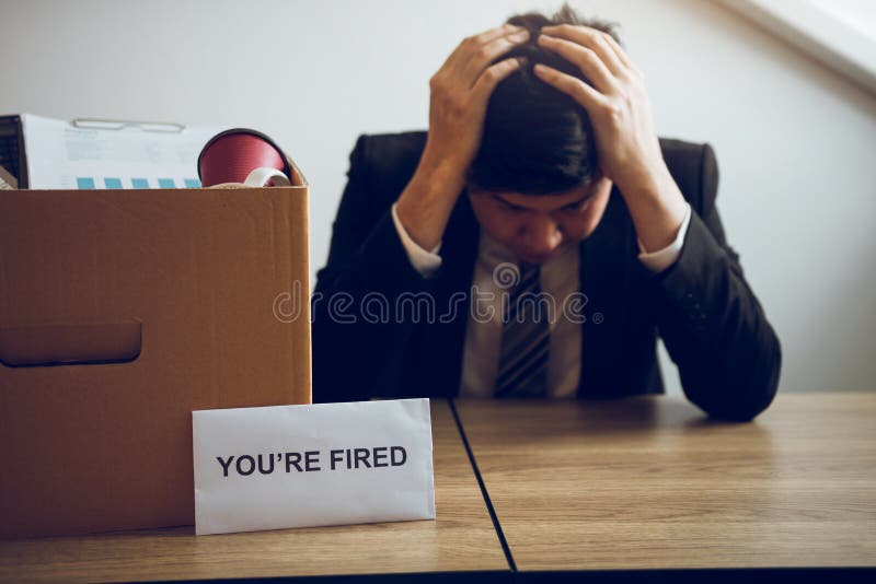 Male employee is stressed or angry while he is fired from being an employee of the company stock photo