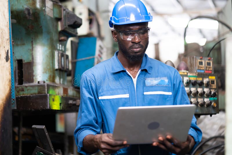 Engineer X Black Market Seller Male Engineer Working on Laptop Computer in Factory. Black Male