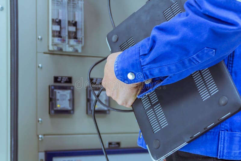 Male Engineers are Checking the Electrical System with Electronic Tools